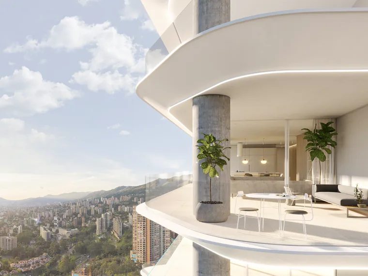 Curved penthouse living room open to a city view
